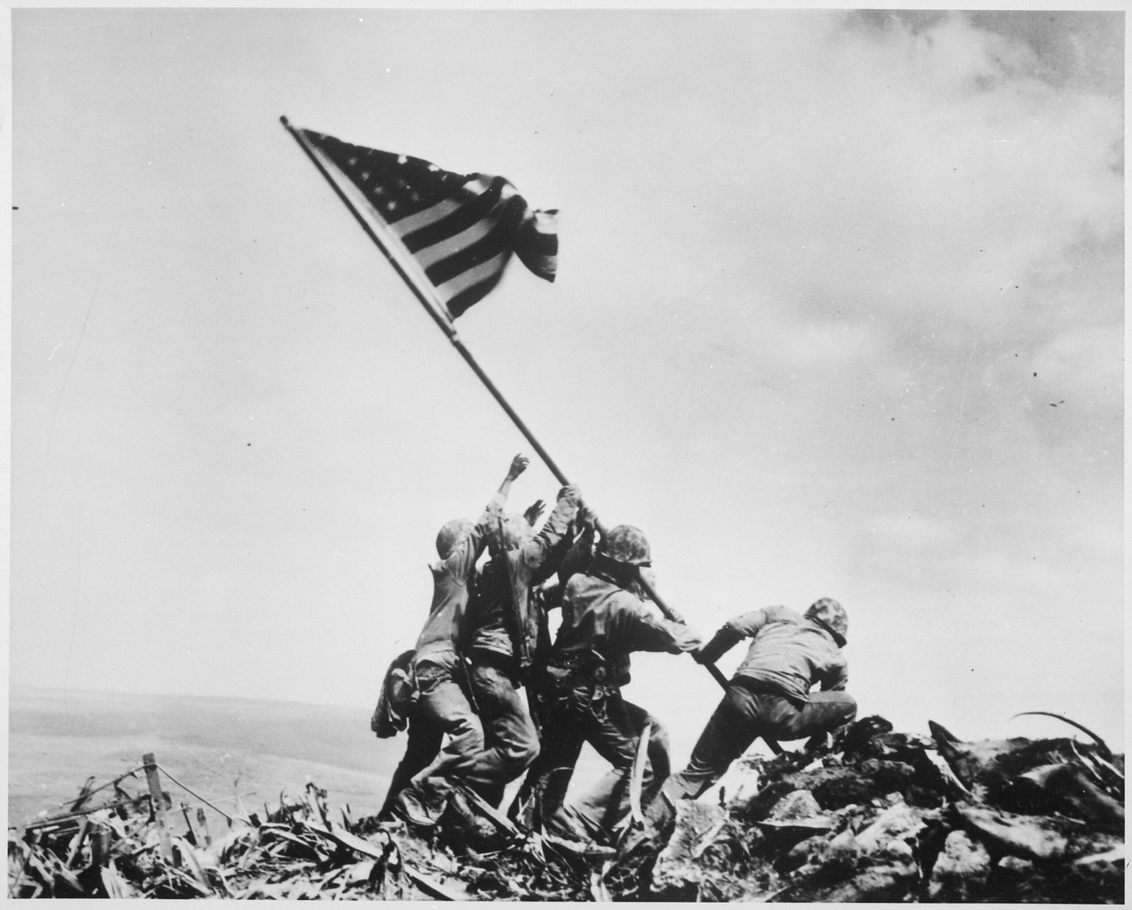 Raising the Flag on Iwo Jima (1945) (From https://news.google.com/newspapers?id=UHZIAAAAIBAJ&sjid=o4IMAAAAIBAJ&pg=1024,6134586, Public domain)