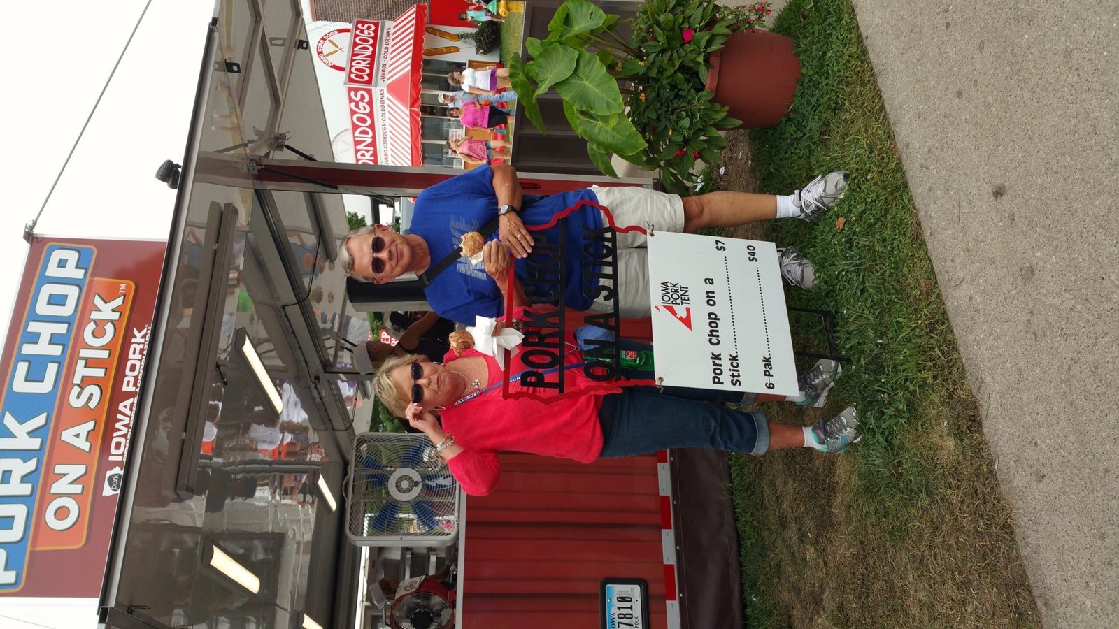 Iowa Pork Producers Tent (Our friends having their first ever pork chop on a stick at the Iowa State Fair!, CC BY-SA 2.0)