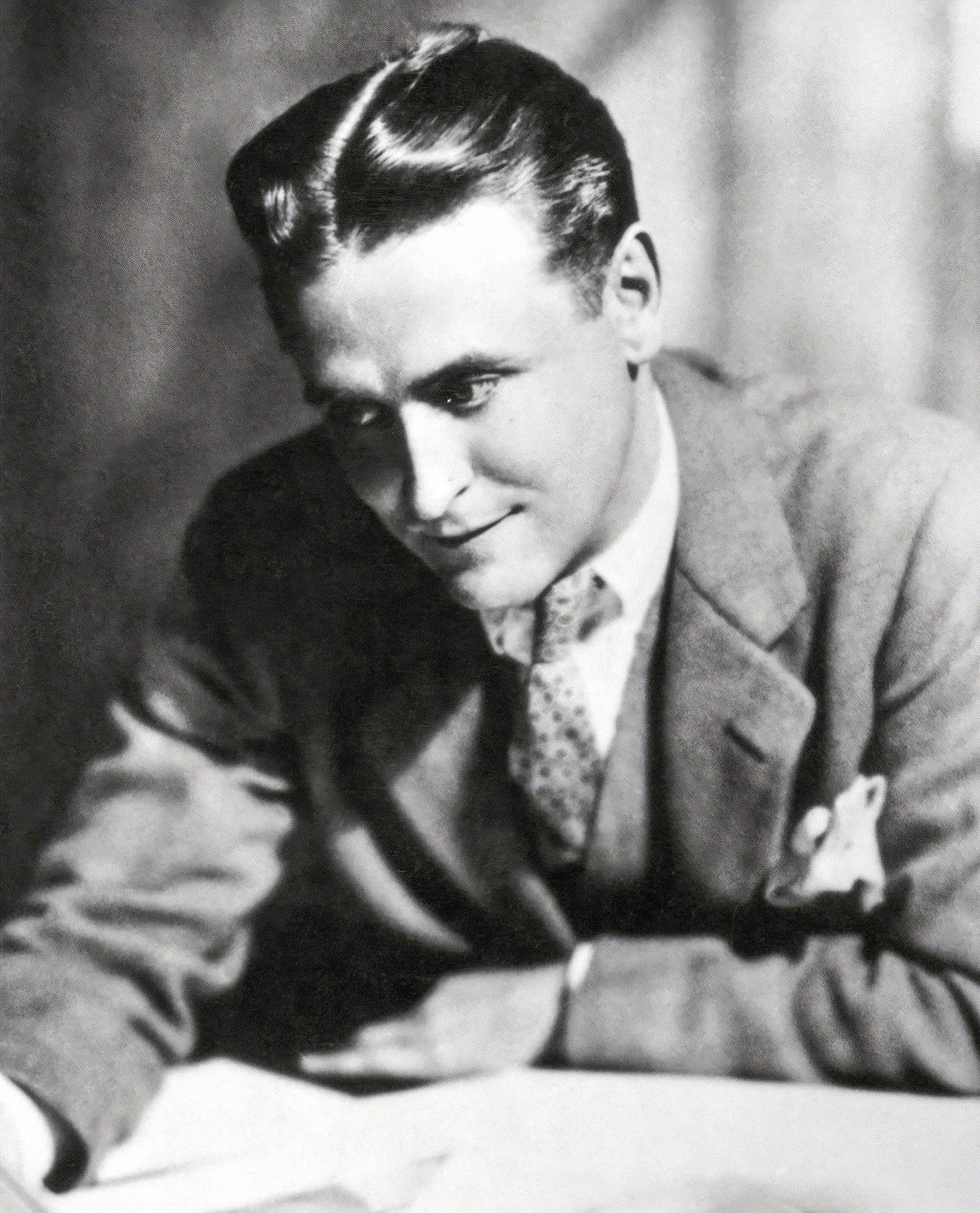 F. Scott Fitzgerald (Variations of this photo, both black-and-white and colorized, were published in a variety of newspapers and magazines throughout the year 1929. This scan is sourced via ElectricLiterature.com., Public domain)